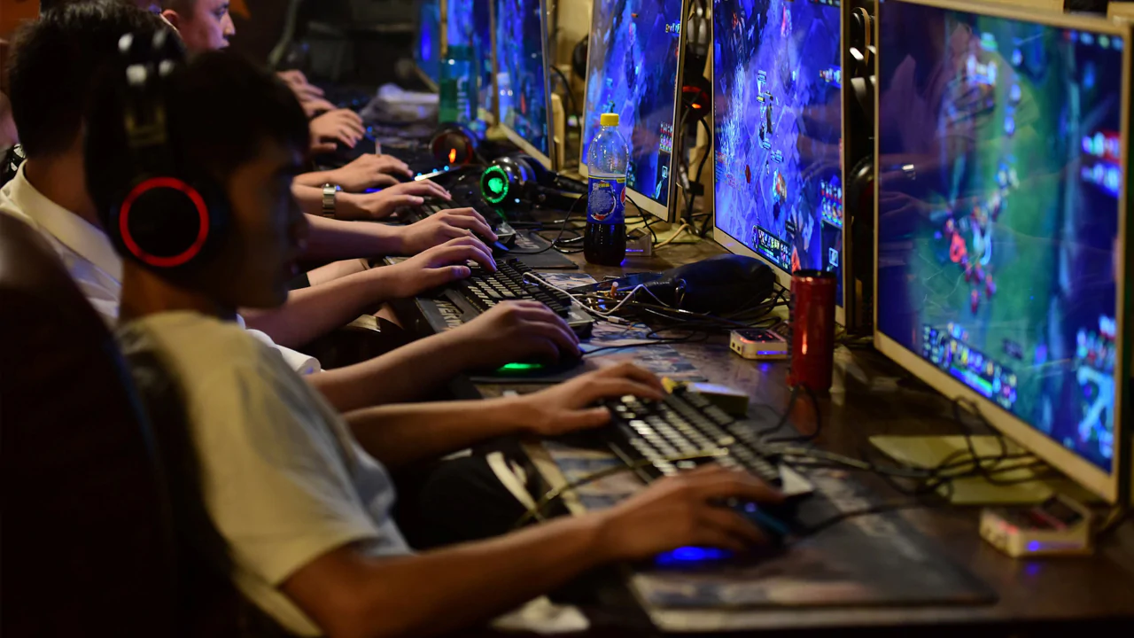 Teens playing online games at an internet café in Fuyang, China.