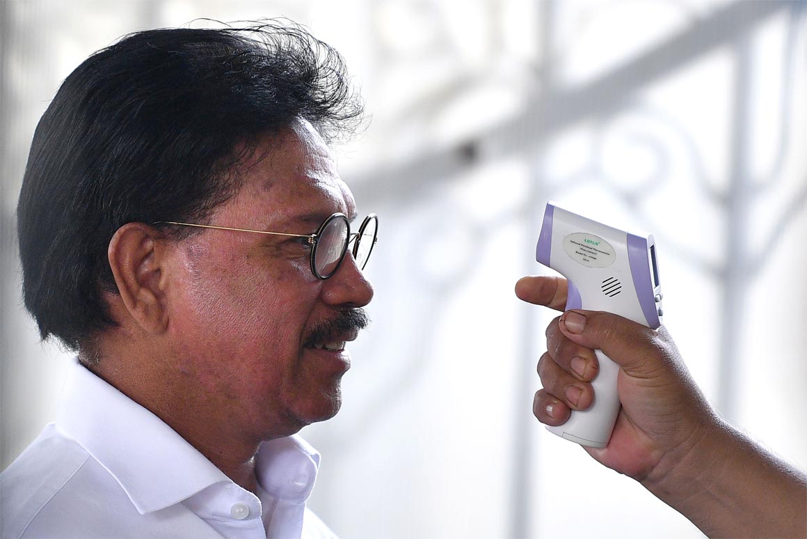 Johnny G. Plate had his temperature checked when entering the Presidential Palace