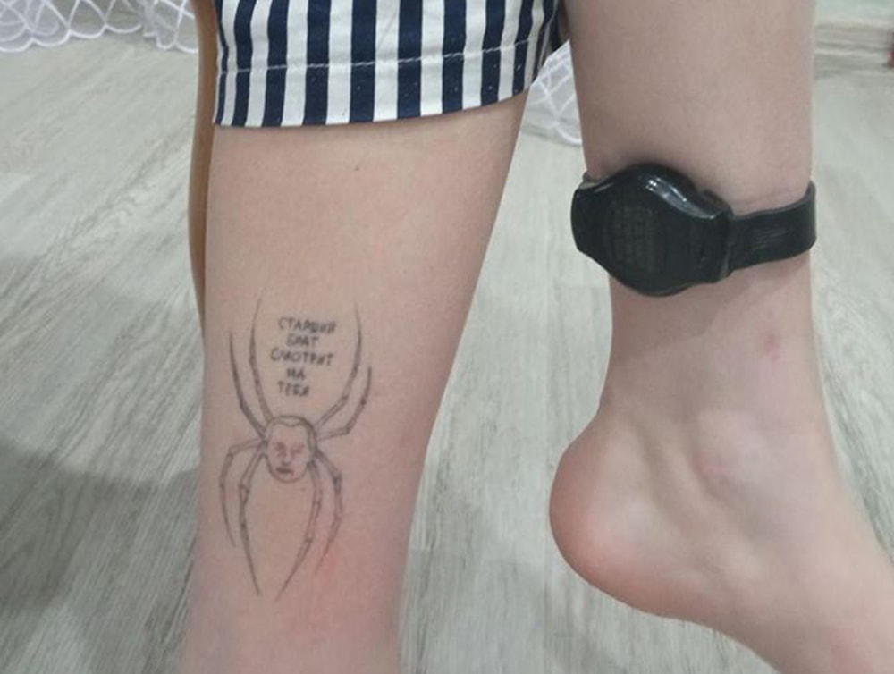 Olesya Krivtsova uses a tracker on her ankle, with another of her ankle showing a tattoo of President Vladimir Putin
