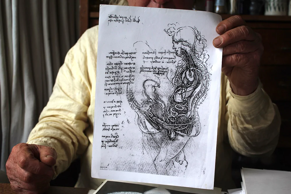 Pek showing a copy of Leonardo da Vinci's sketch of sexual intercourse from the 1490s