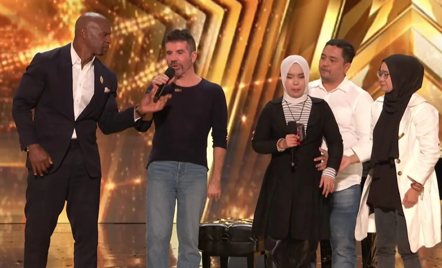 Simon Cowell at the stage with Putri Ariani