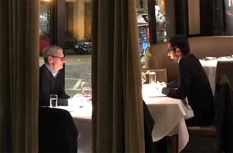 An old photo of Apple CEO Tim Cook and Google CEO Sundar Pichai in a