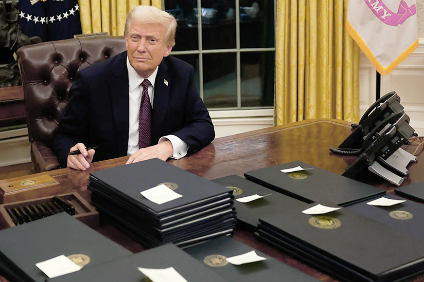 U.S. President Donald Trump signs executive orders in the Oval Office