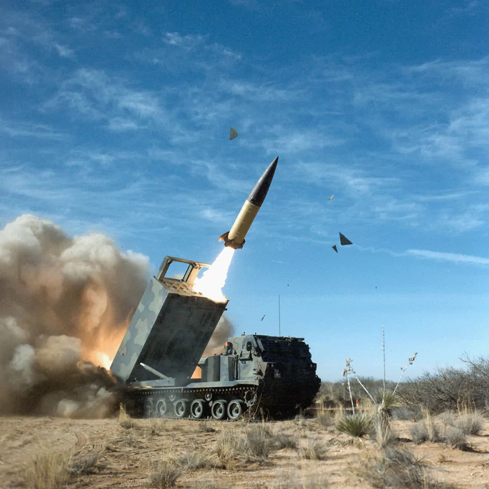 An ATACMS missile fired from a wheeled M142 High Mobility Artillery Rocket System (HIMARS)